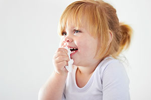 Little girl with tissue