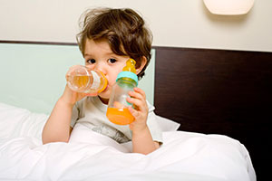 Toddler drinking juice