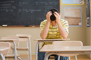 Frustrated teen at desk