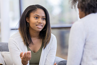 teen girl talking to doctor