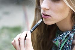 Teen girl with e-cigarette
