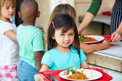 Child getting lunch at school