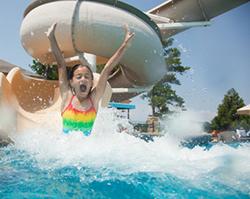 Girl going down water slide